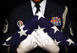 Military service member with flag