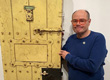 Mark Segal with Oscar Wilde jail cell door