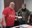 Werner Books Flower Garden Funds Donation to Aging With Pride