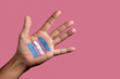 Hand with Trans flag painted on